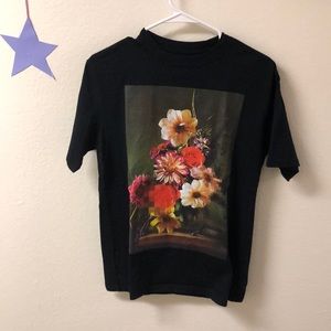 Graphic tee with floral design.